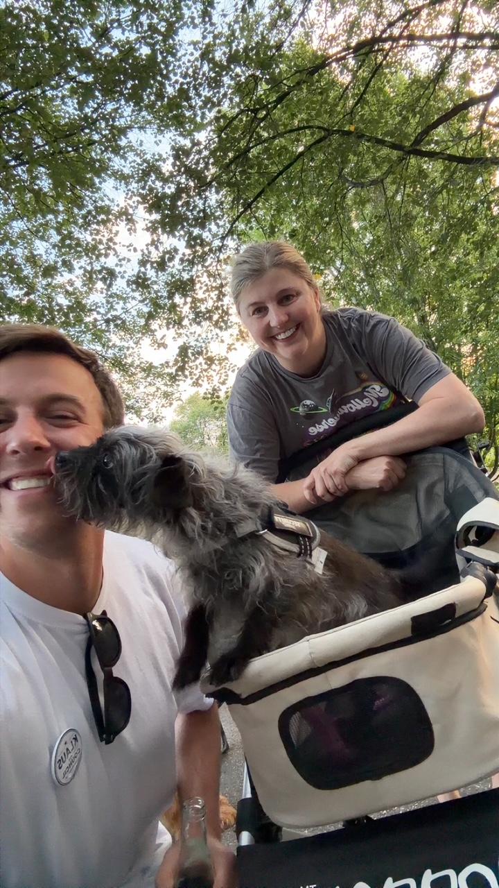 Klaus visiting with residents and a dog at National Night Out